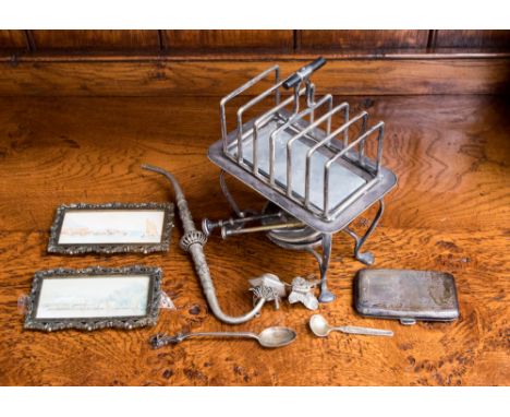 An Asprey & Co. toast rack with burner, two 19th Century miniature water colours, gilt metal framed, silver cigarette case, a