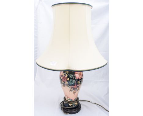 A Moorcroft table lamp of inverted baluster form with tube lined decoration on a peach and blue ground, approx. 48cm high, co