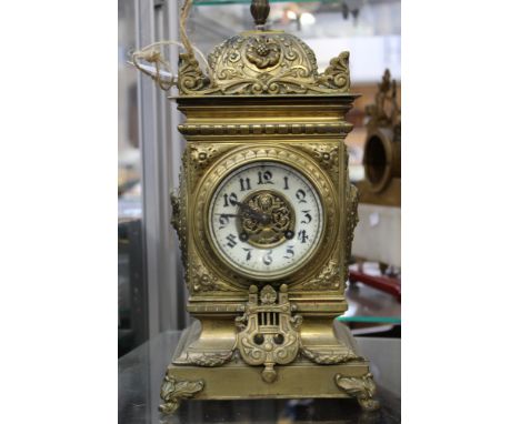 A late 19th Century brass eight day mantle clock, Arabic numerals
