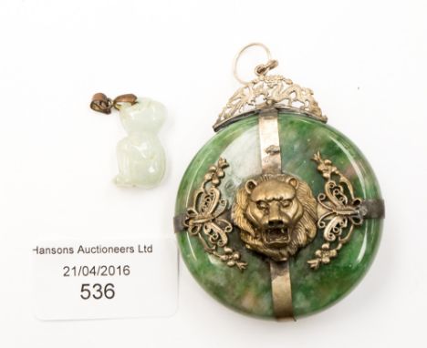 A jadeite and white metal decorated pendant, a pale jade carved bear (2)