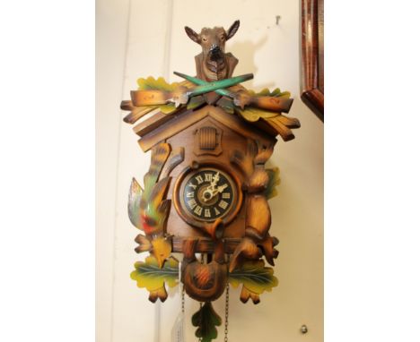 A 20th Century cuckoo wall clock, complete with weights 