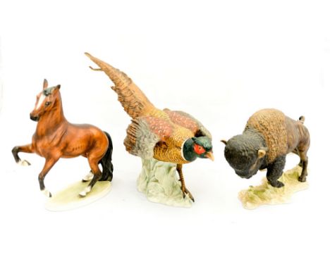 A Goebel figure of a 'Buffalo', CW63 and another figure 'Pheasant' CV98 and 'Horse' CE 309 (3) 