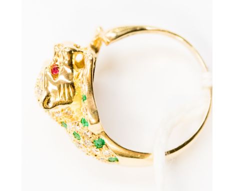 An 18ct gold ring with leopard detail set with diamonds, emeralds and with ruby eyes 5.9g gross weight approx.