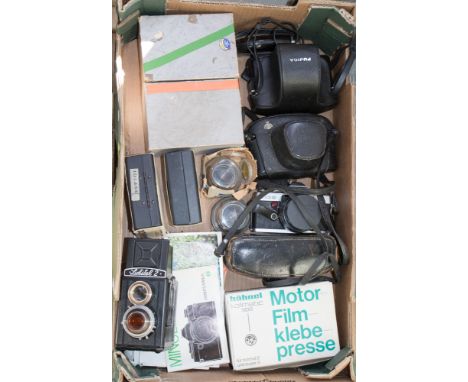 Two boxes of vintage cameras including a Minolta XG-2, a Fujica AZ-1 Pentax Spotmatic along with lenses and a case of filters