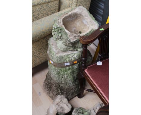 A 19th Century stone statue of a boy playing a wind instrument, AF