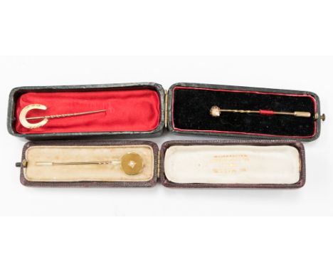Three yellow metal stick/cravat pins two original boxes (5)