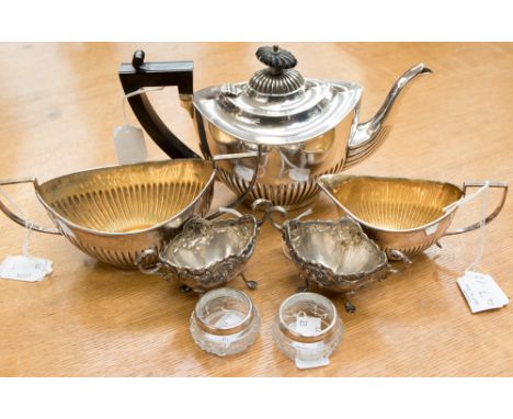 A plated three piece semi-fluted tea service, pair of embossed silver salts hallmarked Birmingham 1898, sponsor's mark Henry 