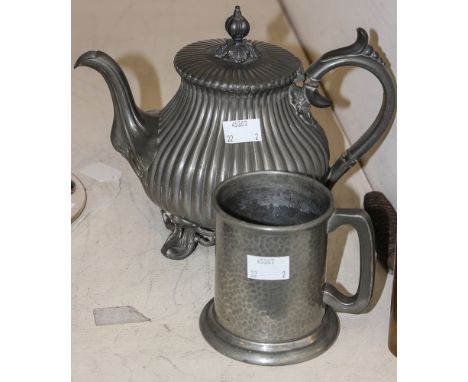 A James Dixon pewter teapot, being of ribbed pattern, on four foliate feet with original finial to cover with a pewter tankar