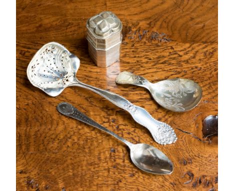 A Georgian silver caddy spoon, a silver sugar sifter spoon etc approx 2.59 ozt