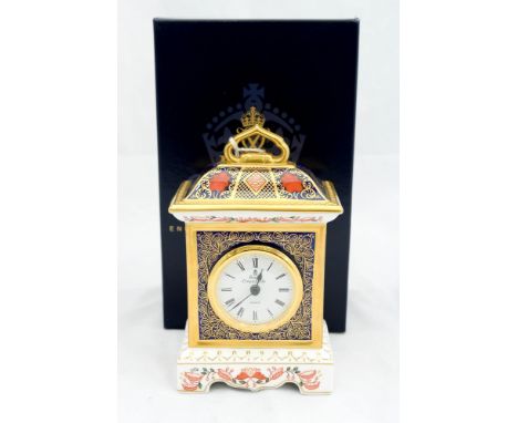 A boxed Royal Crown Derby Imari 1128 pattern quartz table clock, height 18cm 