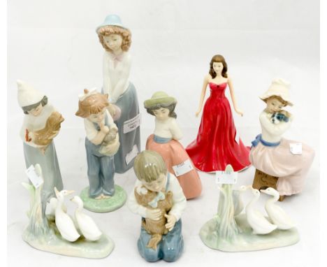 A Royal Doulton figure 'January - Garnet' HN4970, together with a Lladro figure of a girl holding a hen and seven Nao figures