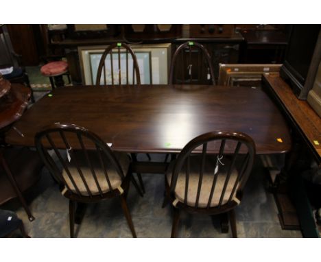 An Ercol elm topped dining table, together with a set of five matching elm seated chairs, with rodded backs, comprising an ar