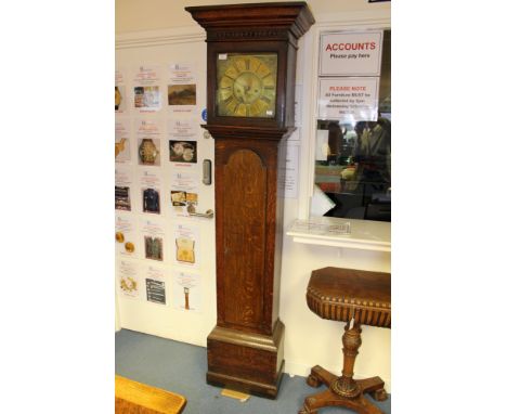 A George III oak eight day longcase clock, the dial inscribed 'Thomas Bridge', with black Roman numerals and gilt spandrels