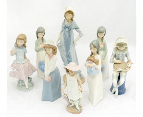 A collection of  eight Nao figurines of girls