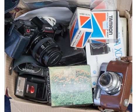 A collection of vintage cameras and lenses, including a Minolta XD5 and a Voigtlander VITO BL