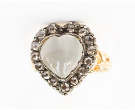 A moonstone and diamond ring, the heart-shaped cats-eye moonstone set with a surround of fifteen rose cut diamonds, on yellow