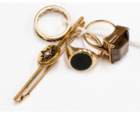 A yellow metal bar brooch with blue enamel and seed pearl decoration, a ruby and diamond eternity ring (af) 9ct gold, a 9ct g