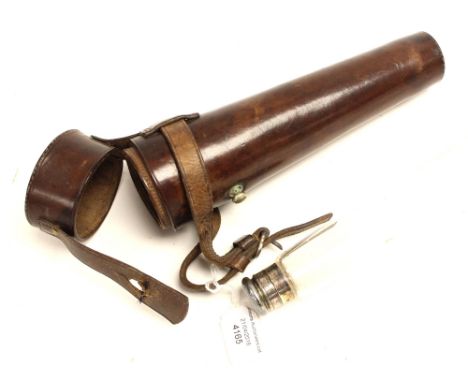 A hunting flask with leather harness 