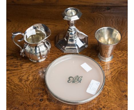 A Scandanavian silver milk jug 3.3ozt approx., a filled candlestick short, a silver beaker 1.73ozt approx. and a pink card pl