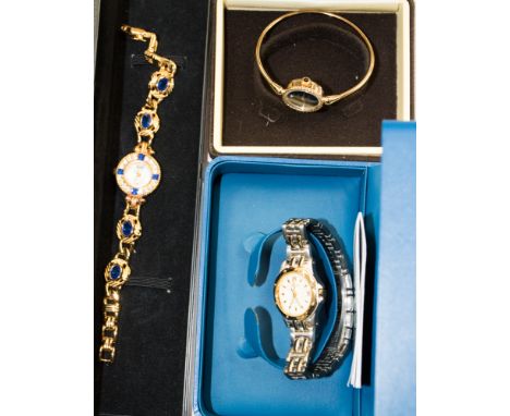 A Rotary ladies' gold plated and stainless steel sapphire wristwatch, a gold plated and paste dress watch and another bangle 