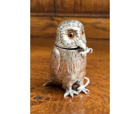 A Victorian silver novelty mustard pot in the form of a standing owl, inset with glass eyes, the body cast and chased with a 