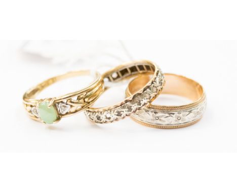 A 9ct gold jade and diamond ring, size P, a 9ct gold wedding band, size P; and a yellow metal eternity band, size O, total go