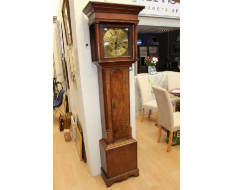 A George III oak eight day longcase clock, the brass dial inscribed 'James Bonn, Matlock', the case door set between quarter 