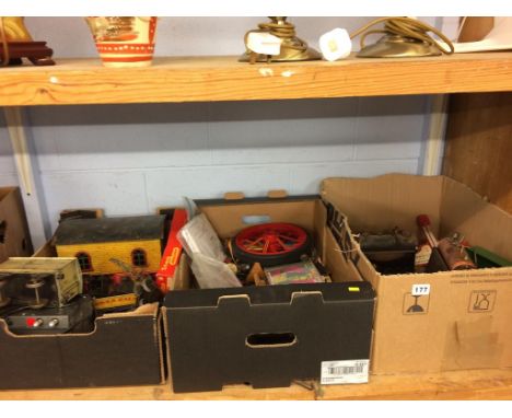 A shelf of assorted trains and model steam engines