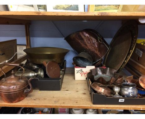 A shelf of assorted brassware etc.