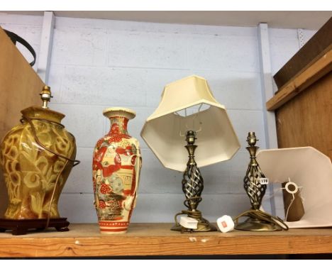 A shelf of assorted lamps