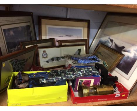 A shelf of assorted, to include plane prints, bow ties etc.