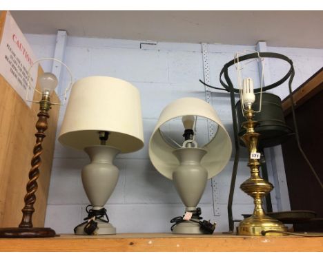 A shelf of assorted lamps