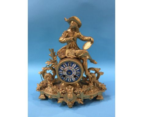 A gilt metal mantle clock