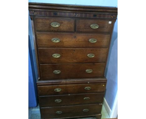 A Georgian  oak chest on chest (has woodworm) supported on bracket feeet.