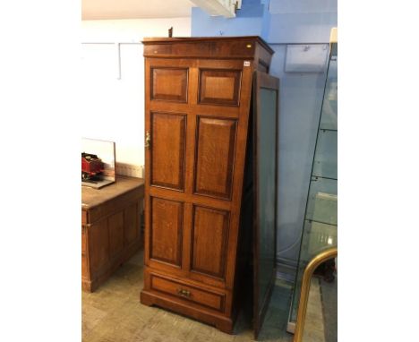 An oak single door wardrobe and a mirror