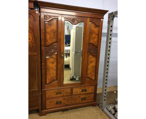 A walnut mirror door wardrobe