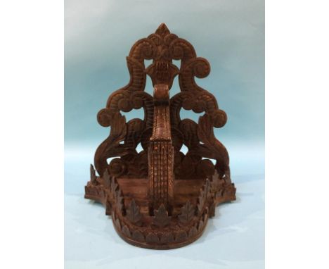 A carved Black Forest wall bracket, dated 1871