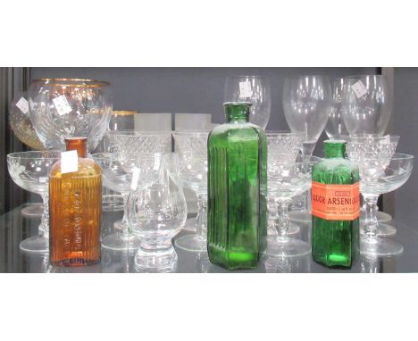 A collection of glassware including decanters, one with a silver collar, drinking glasses including champagne saucers, martin