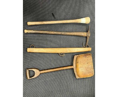 Four rustic tools to include a shovel, yoke, large pestle and an axe (4)