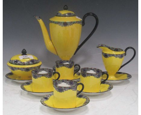 Circa 1900 coffee set, the bright yellow ground decorated with a rim of swagged stylised floral design. Royal Worcester for W