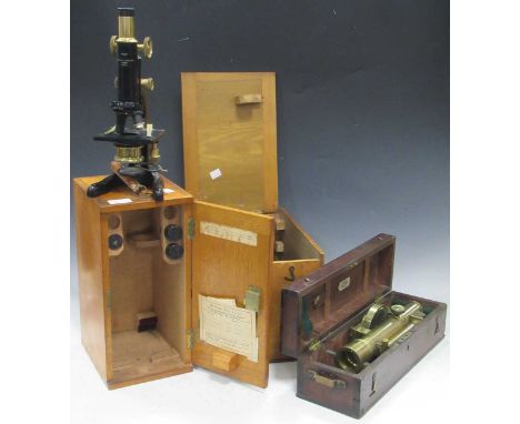 A Watson 'Kima' monocular microscope, boxed; a brass surveyor's level by Troughton &amp; Simms, boxed; and a spectrometer