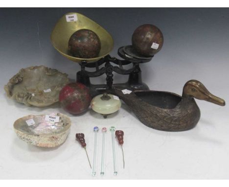 A set of 19th century weighing scales, a naturalistic brass duck, and a set of three brass bound balls with star design. Toge