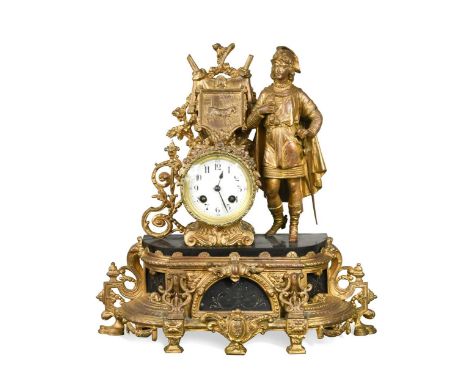 A gilt metal mantel clock, late 19th century, the case modelled as a Medieval courtier beside a goat-motif shield above the w