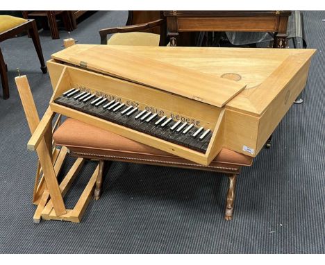 A modern straight sided spinet on stand, made by John Storrs of Chichester circa 1980, in a pale oak case, inset with scallop