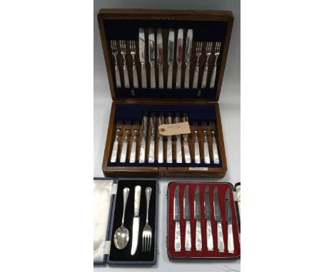 A cased set of twelve pairs of silver dessert knives and forks with mother-of-pearl handles, together with a cased silver Chr