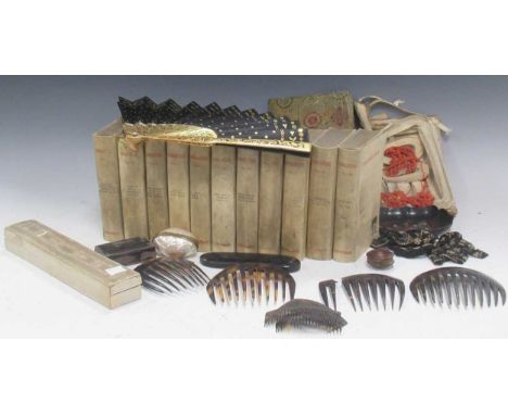 A collection of objects including a fan, tortoiseshell combs, spectacle case, snuff box, coral beads, 11 books by William Sha