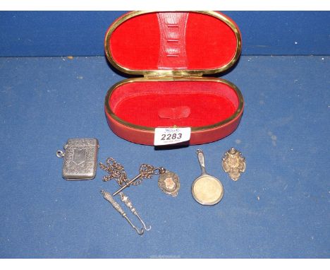 A small quantity of silver items to include: a vesta case, two sporting sport fobs, small button hooks, etc.
