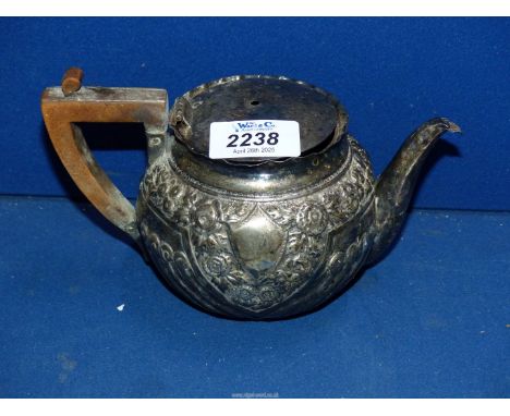 An embossed Silver Teapot, London 1895, maker GMJ Josiah Williams & Co (George Maudsley Jackson) with wooden handle, a/f, 246