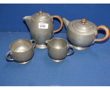 A Tudric Pewter Teaset to include teapot, water pot, jug and bowl.