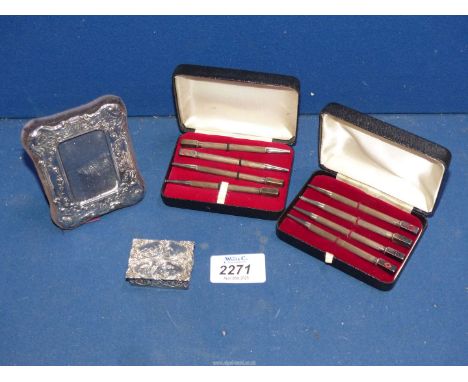 A small quantity of Silver incl. two cased sets of bridge pencils, small photograph frame and a small pill pot with embossed 